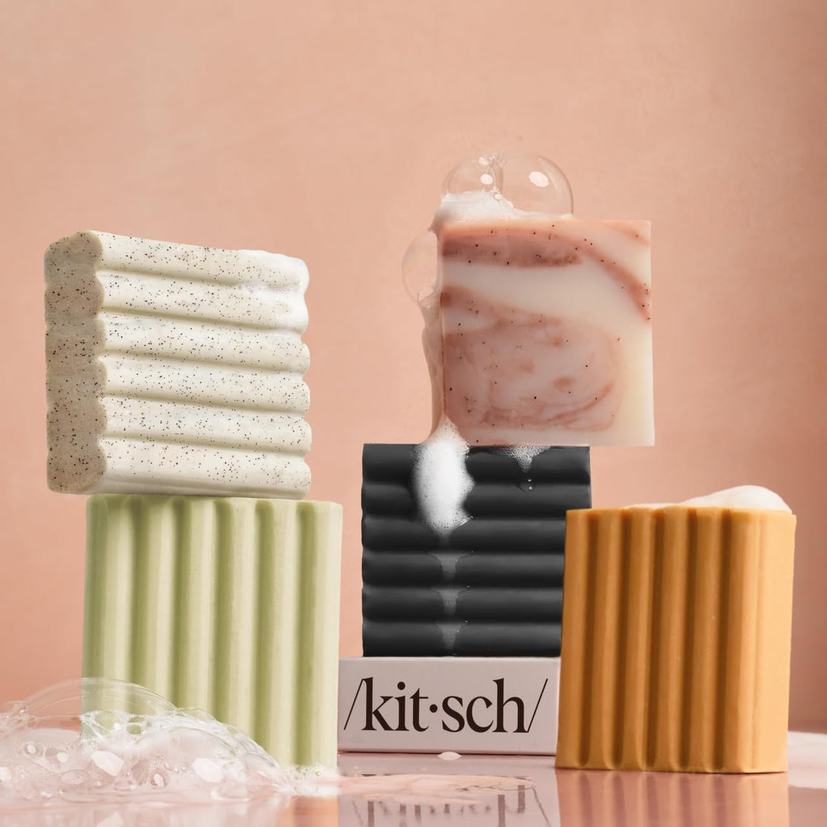 Kitsch recyclable packaging beside bar emphasizing low-waste routine benefit