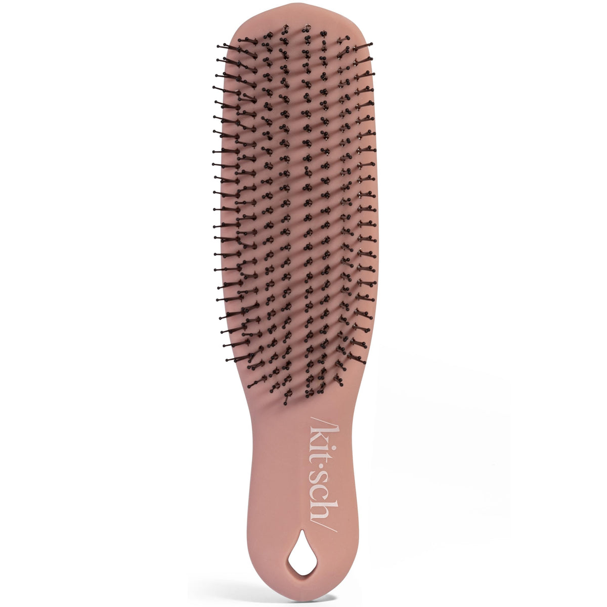 Kitsch closeup of flexible bristles demonstrates gentle exfoliation and buildup removal