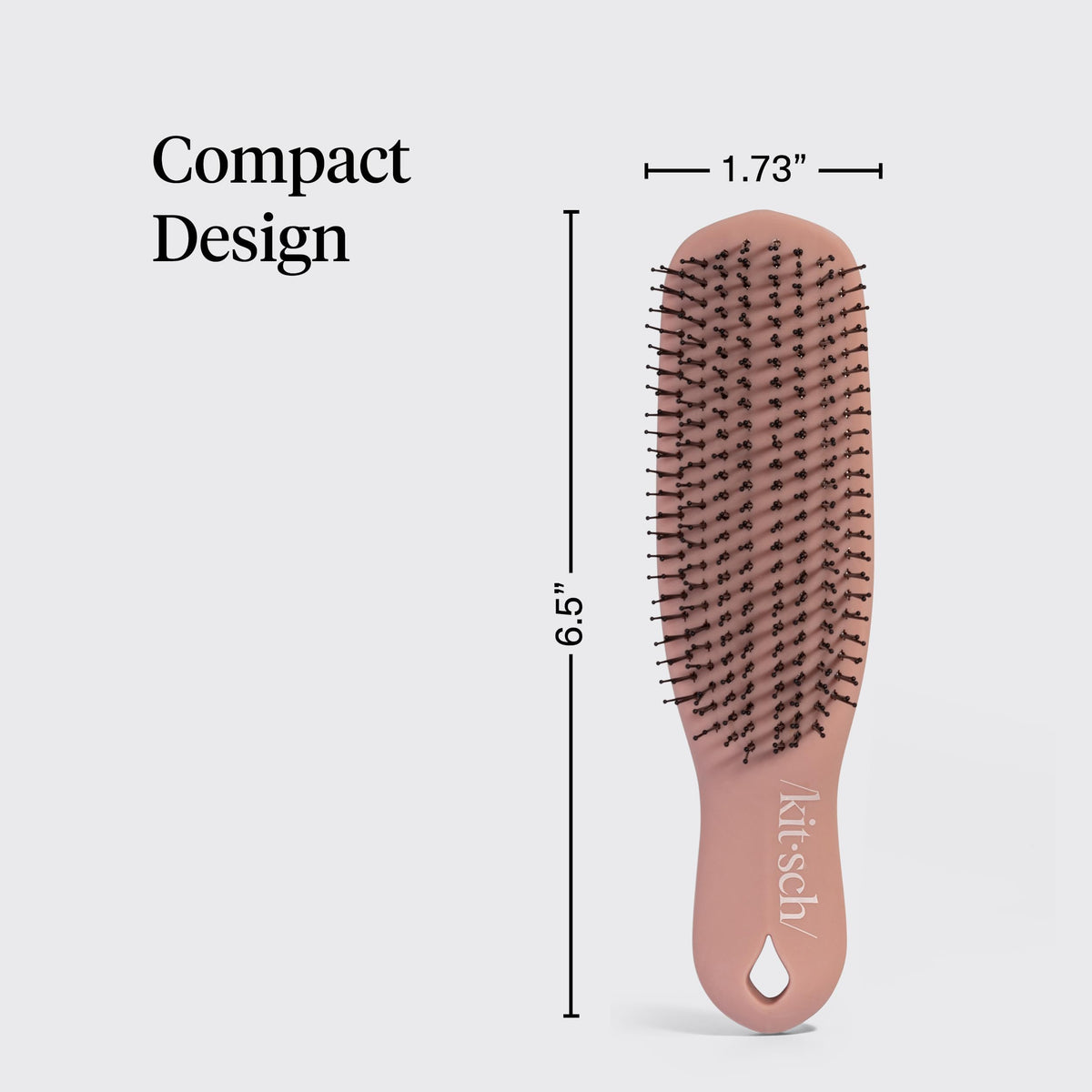 Kitsch brush size comparison in hand to show compact, travel-friendly scale