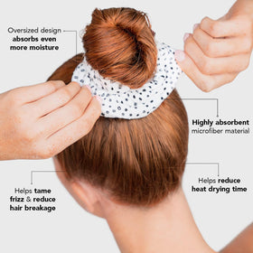 Kitsch scrunchie securing wet hair after shower to speed drying