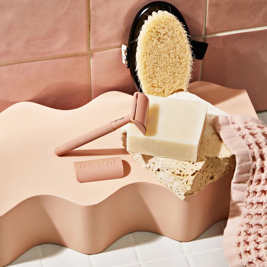 Kitsch shaving bar in travel kit flatlay conveying spill-free convenience