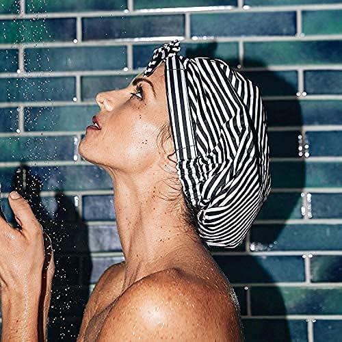 Kitsch shower cap held in a hand to show large size and roomy fit