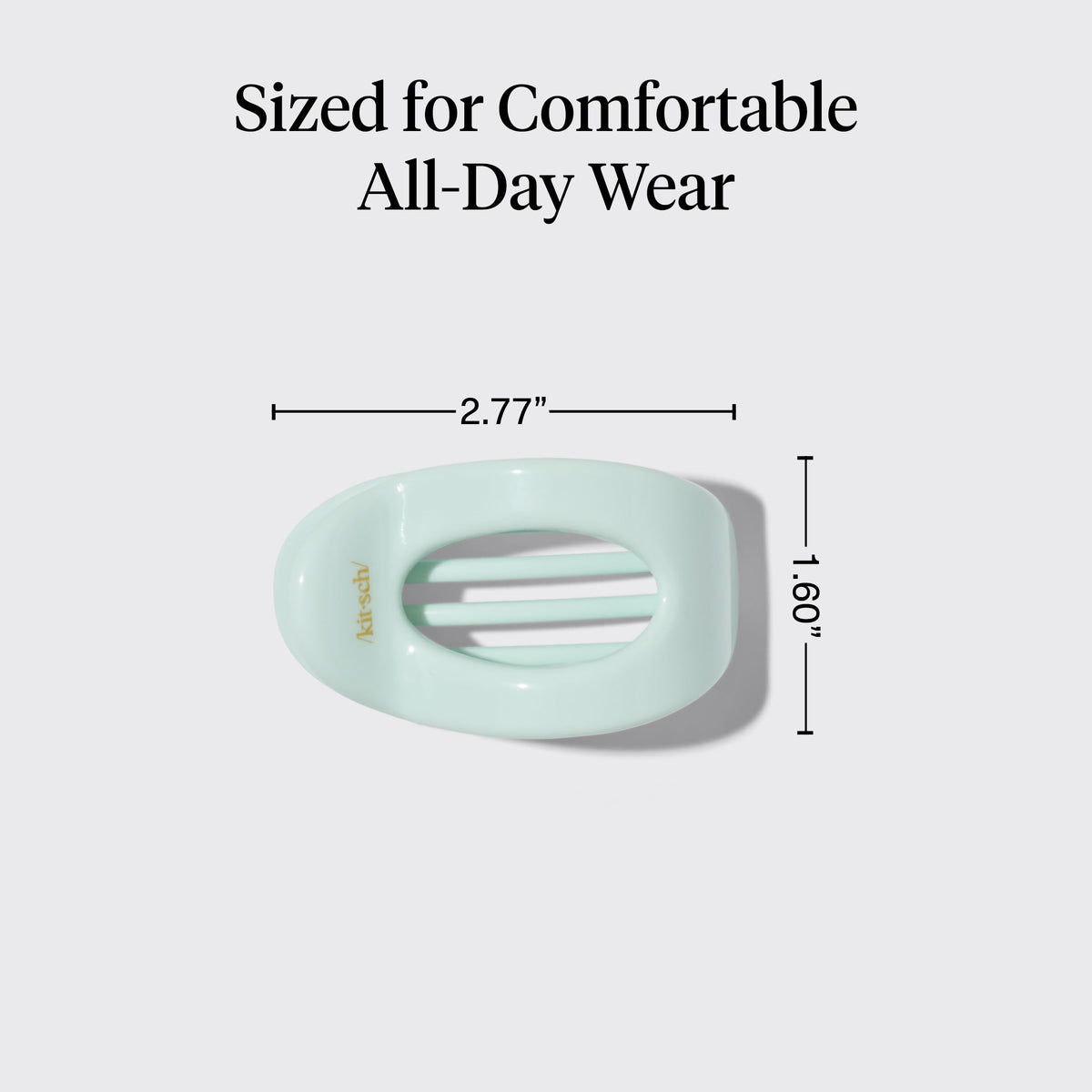 Kitsch size comparison in hand showing compact, travel-friendly dimensions
