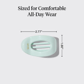 Kitsch size comparison in hand showing compact, travel-friendly dimensions