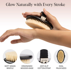 Kitsch brush next to hand to show scale and portability for travel-friendly self-care