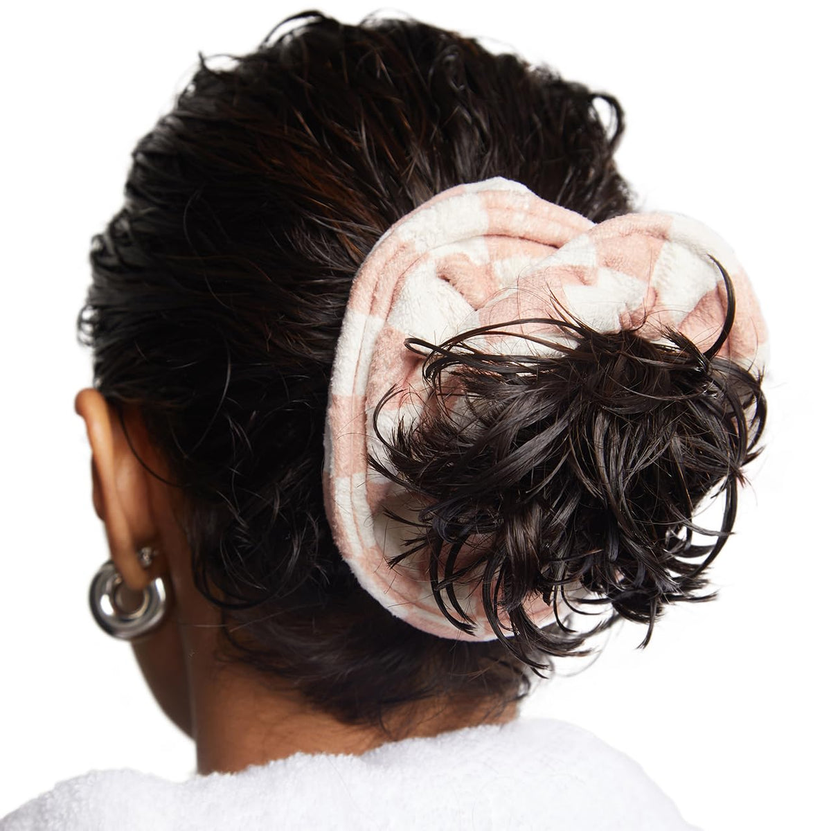 Kitsch scrunchie placed beside a hand for scale, shows large size for thick hair