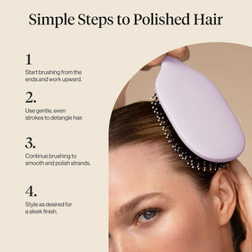 Kitsch brush on vanity with hair products suggesting polished everyday styling