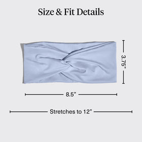 Kitsch headband stretched on hand showing flexible secure fit