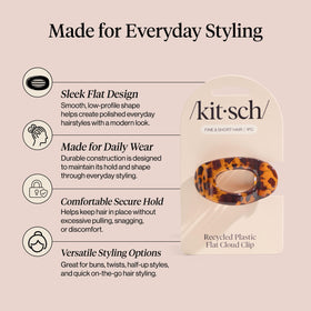 Kitsch tortoise clipped in half-up hair illustrating polished hairstyle