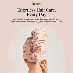 Kitsch lifestyle shot in bathroom showing practical everyday hair‑care use