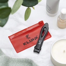 KLIPP size comparison beside ruler showing 15 mm wide jaw clearance