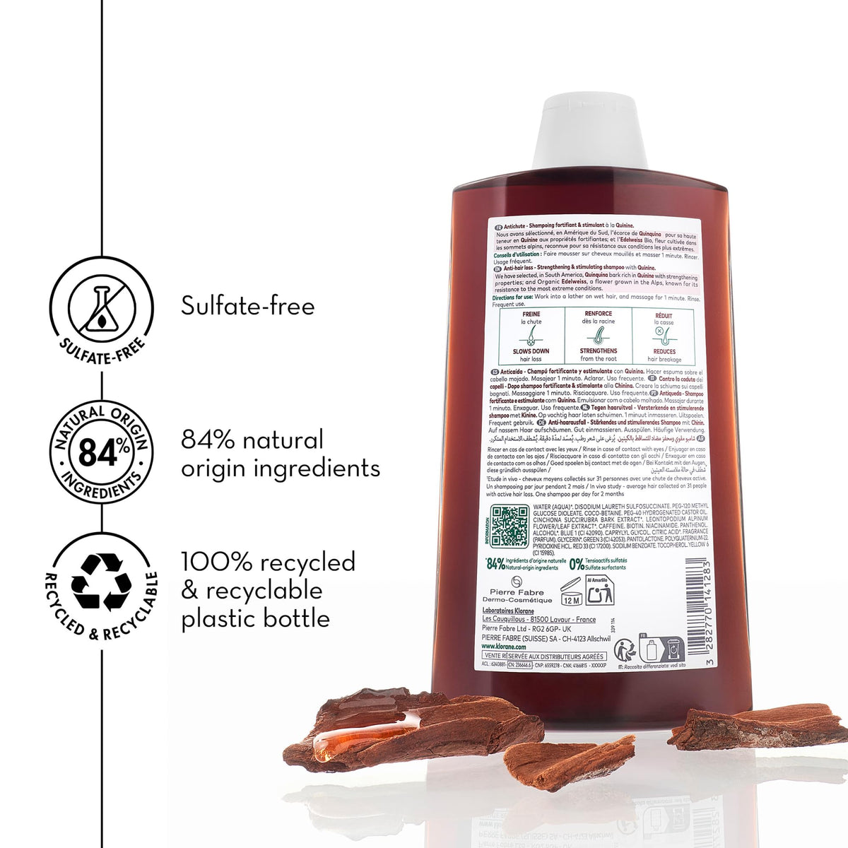 Klorane bottle held in hand to show 13.5 fl oz size for real-world scale