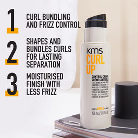 KMS cream texture on fingertip illustrating smooth consistency and easy spread