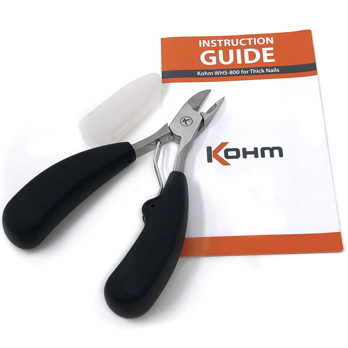 KOHM clippers held in hand showing scale and ergonomic non-slip control