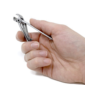 KOHM used by a senior with caregiver assistance showing safe, steady trimming