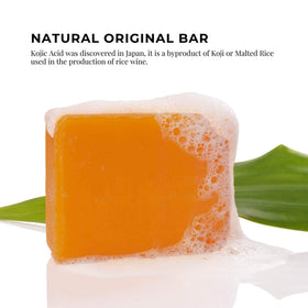 Kojie San bar beside ruler for size comparison indicating portable 65g
