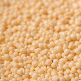 KoluaWax beads close-up texture showing uniform grain for even melting