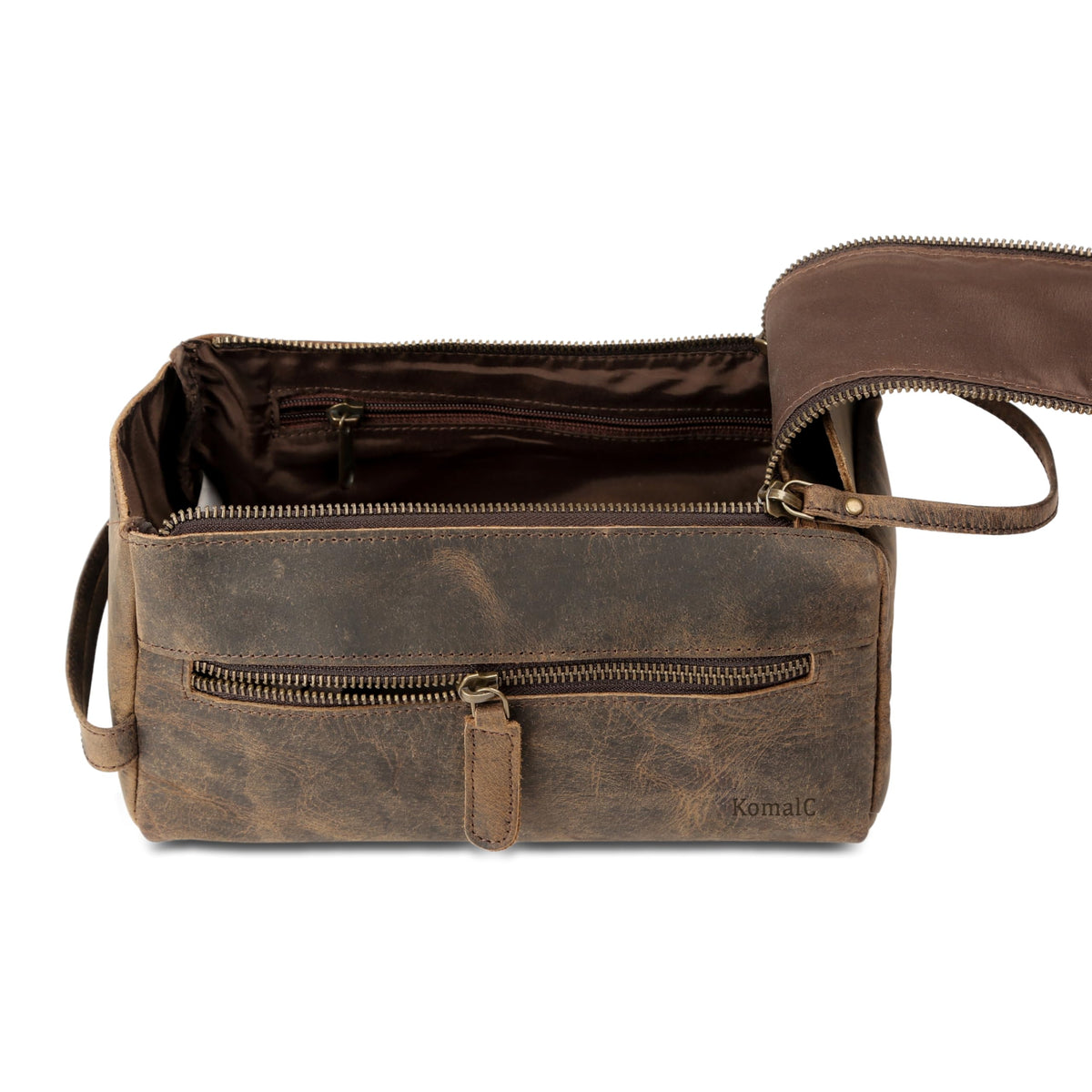 KomalC external zip pocket holding razor and small items for quick access benefit