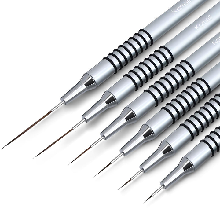 Komall metallic brush set front view showing six liner sizes and silver handles for precise work