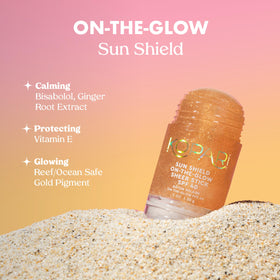 Kopari applying sunscreen to cheek demonstrating quick reapplication over makeup