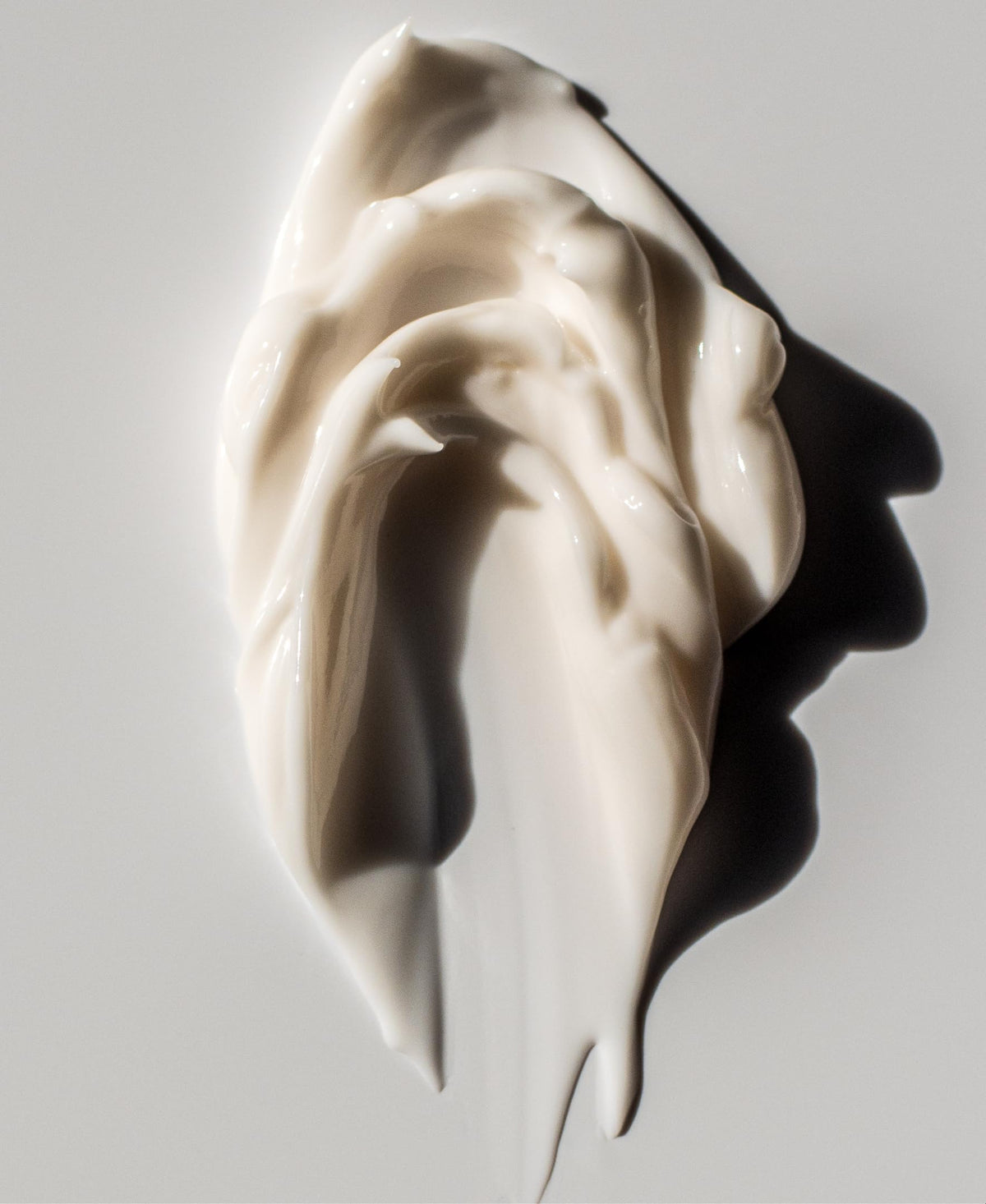 KORRES lotion texture dispensed to show fast-absorbing cream and smooth finish