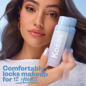 Model wearing Kosas mist for all-day makeup with natural finish and refreshed skin