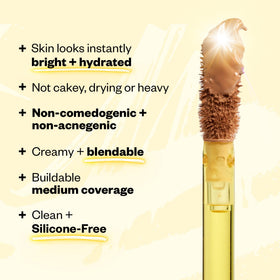 Arm swatches of Kosas Revealer Tone 03 W to display true color and blendability