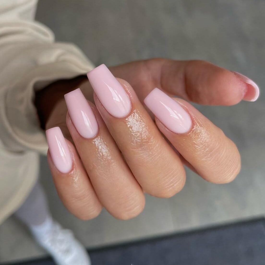 KQueenest glossy nail surface close-up revealing smooth pale pink finish and durable gel texture