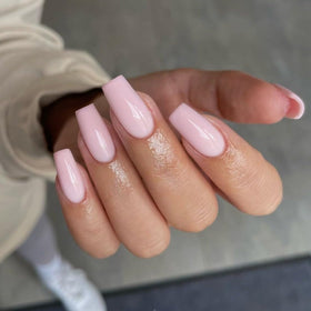 KQueenest glossy nail surface close-up revealing smooth pale pink finish and durable gel texture