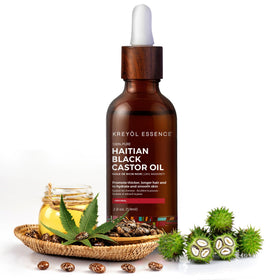 KREYÒL ESSENCE castor oil pouring from dropper demonstrating rich texture and coverage