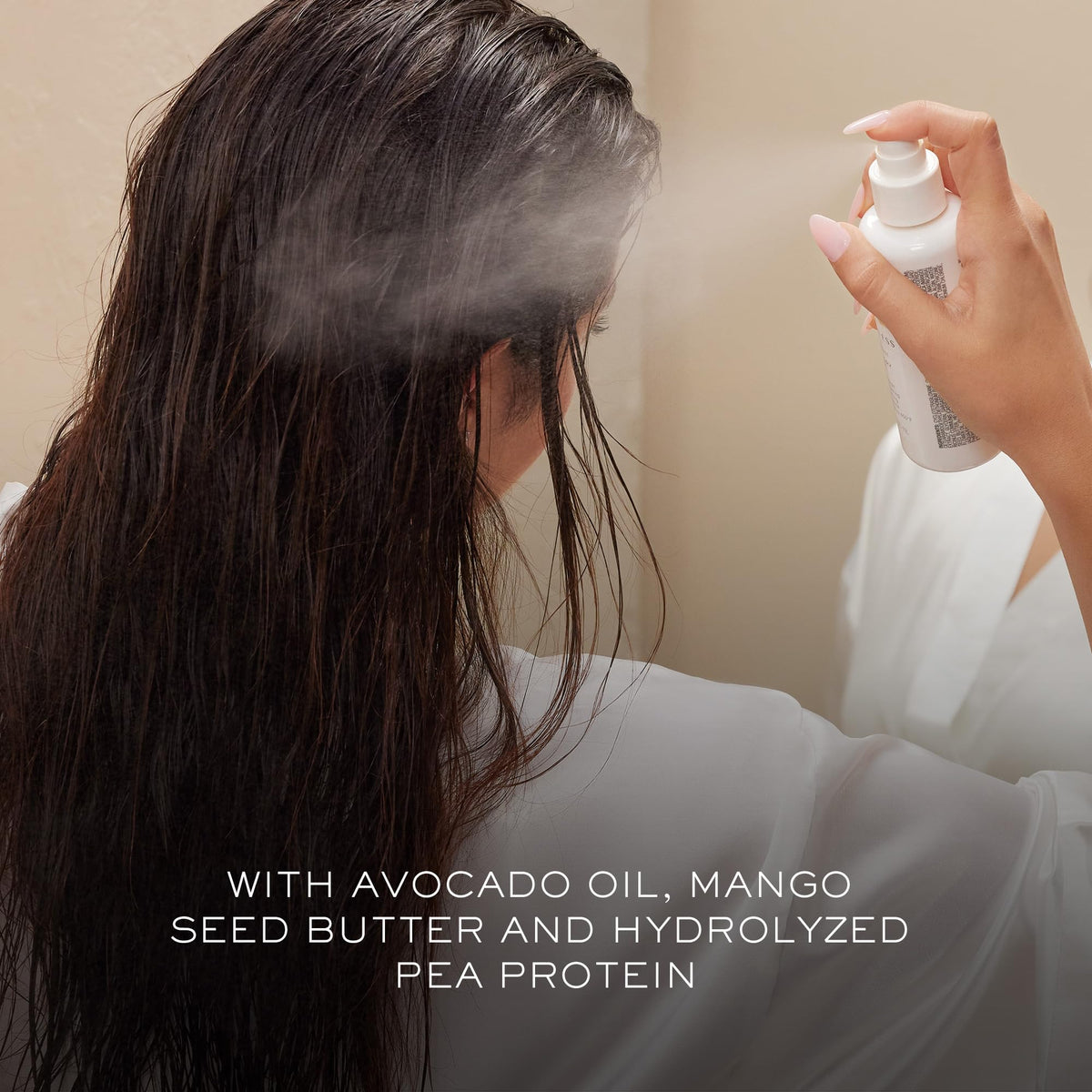 Kristin Ess bottle label close-up highlighting sulfate-free and heat protection benefit