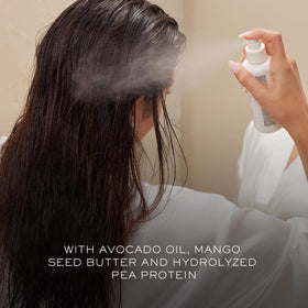 Kristin Ess bottle label close-up highlighting sulfate-free and heat protection benefit