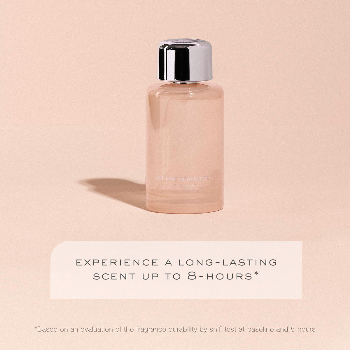 Kristin Ess bottle near pear and magnolia illustrating scent blend