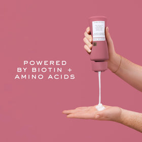 Kristin Ess open jar texture highlighting rich moisturizing formula benefits