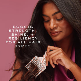 Kristin Ess next to a ruler showing 10 oz size and travel-ready benefit