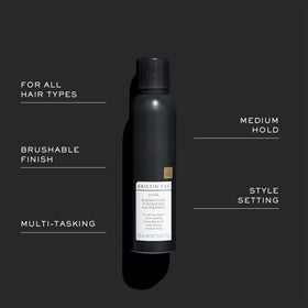 Kristin Ess on model with wavy hair showing defined, brushable finish