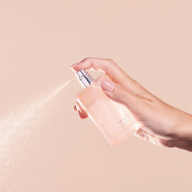Kristin Ess bottle on vanity conveying everyday styling and fresh scent
