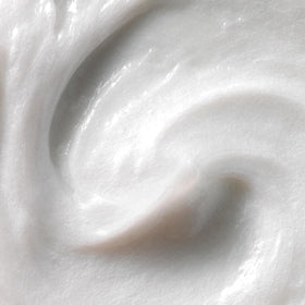 Kristin Ess close-up pour of conditioner texture showing rich slip for easier detangling