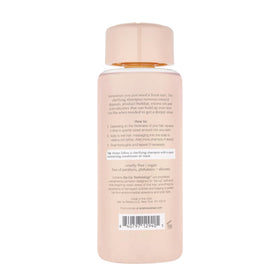 Kristin Ess pump and label closeup highlighting clean ingredients and easy dispensing