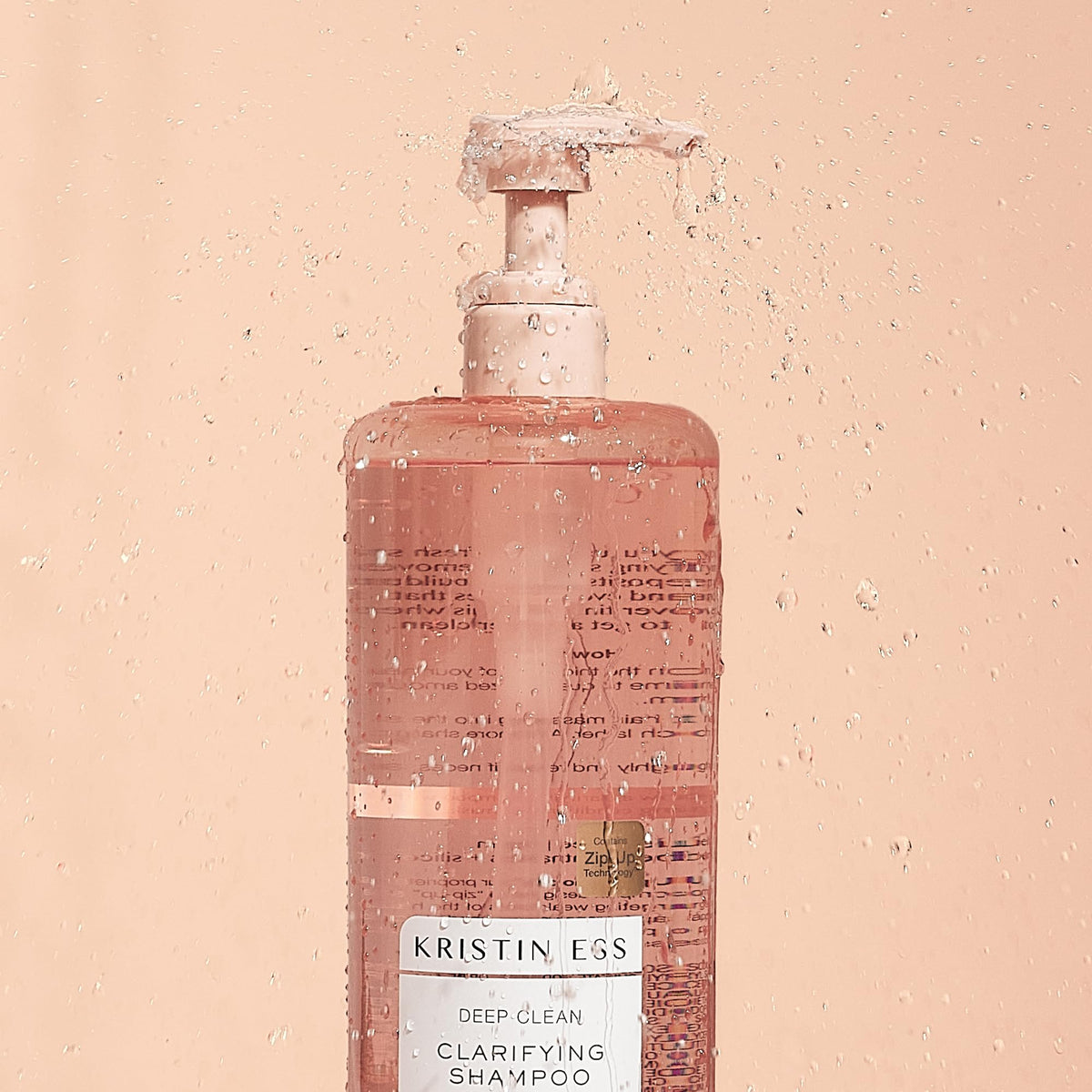 Kristin Ess shampoo lather close-up demonstrating deep-cleansing texture