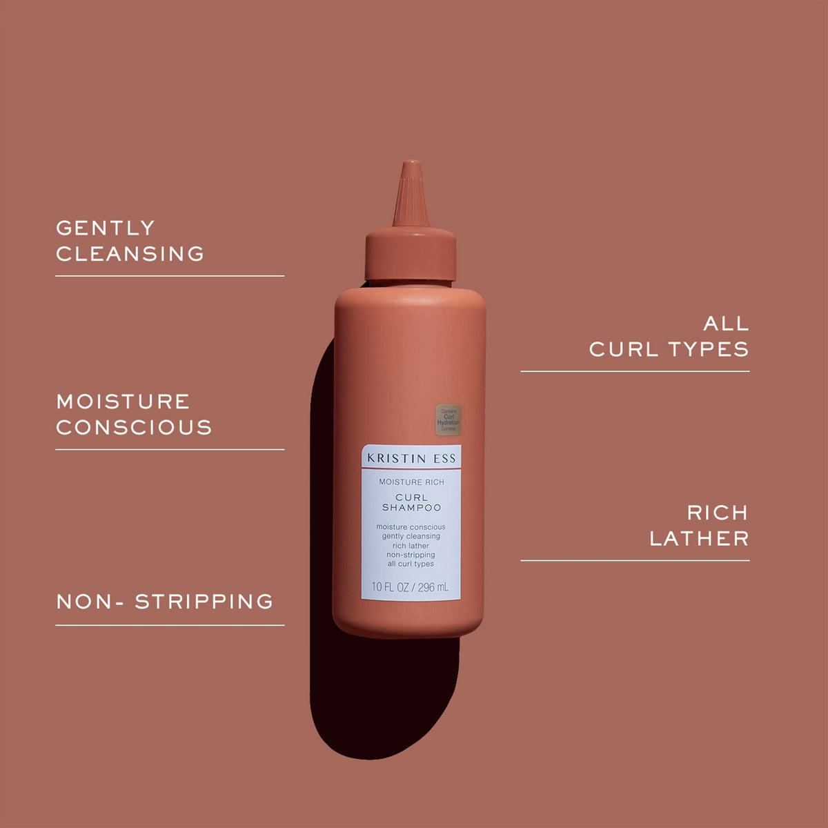 Kristin Ess shampoo lather closeup demonstrating rich foam and gentle cleanse