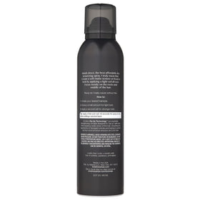 Kristin Ess spray nozzle close-up producing fine mist for even hold