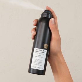 Kristin Ess close-up texture of the spray showing powdery absorbency and lift