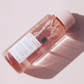 Kristin Ess shampoo lather close-up demonstrating deep cleansing action