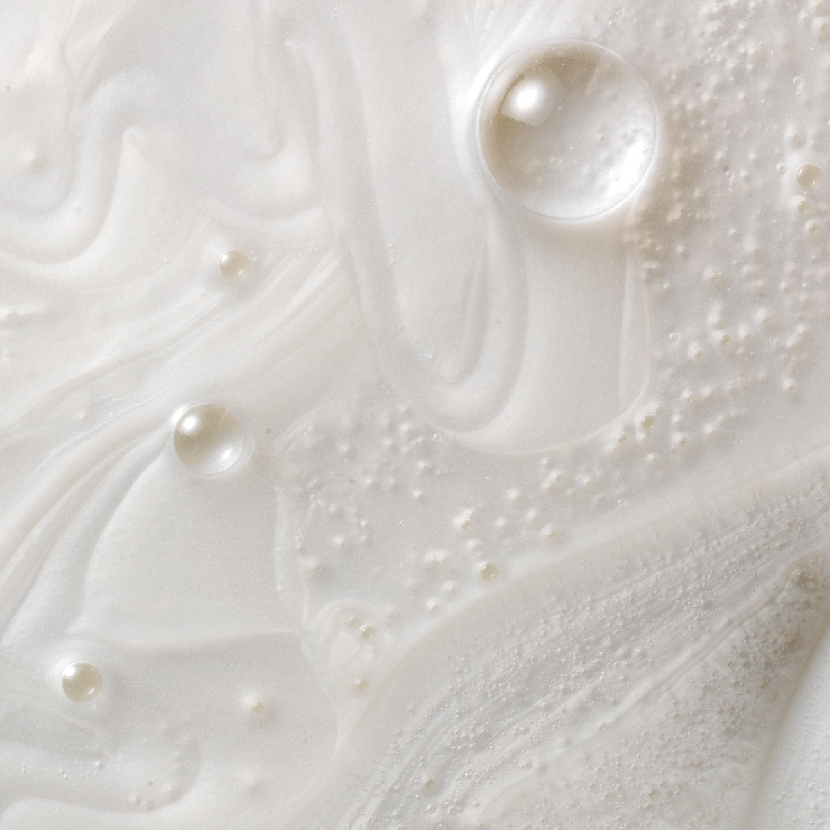 Kristin Ess creamy foam texture highlighting moisturizing lather