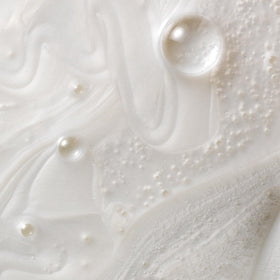 Kristin Ess creamy foam texture highlighting moisturizing lather