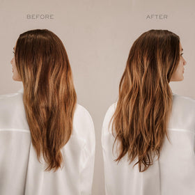 Kristin Ess being sprayed on wavy hair to create tousled texture