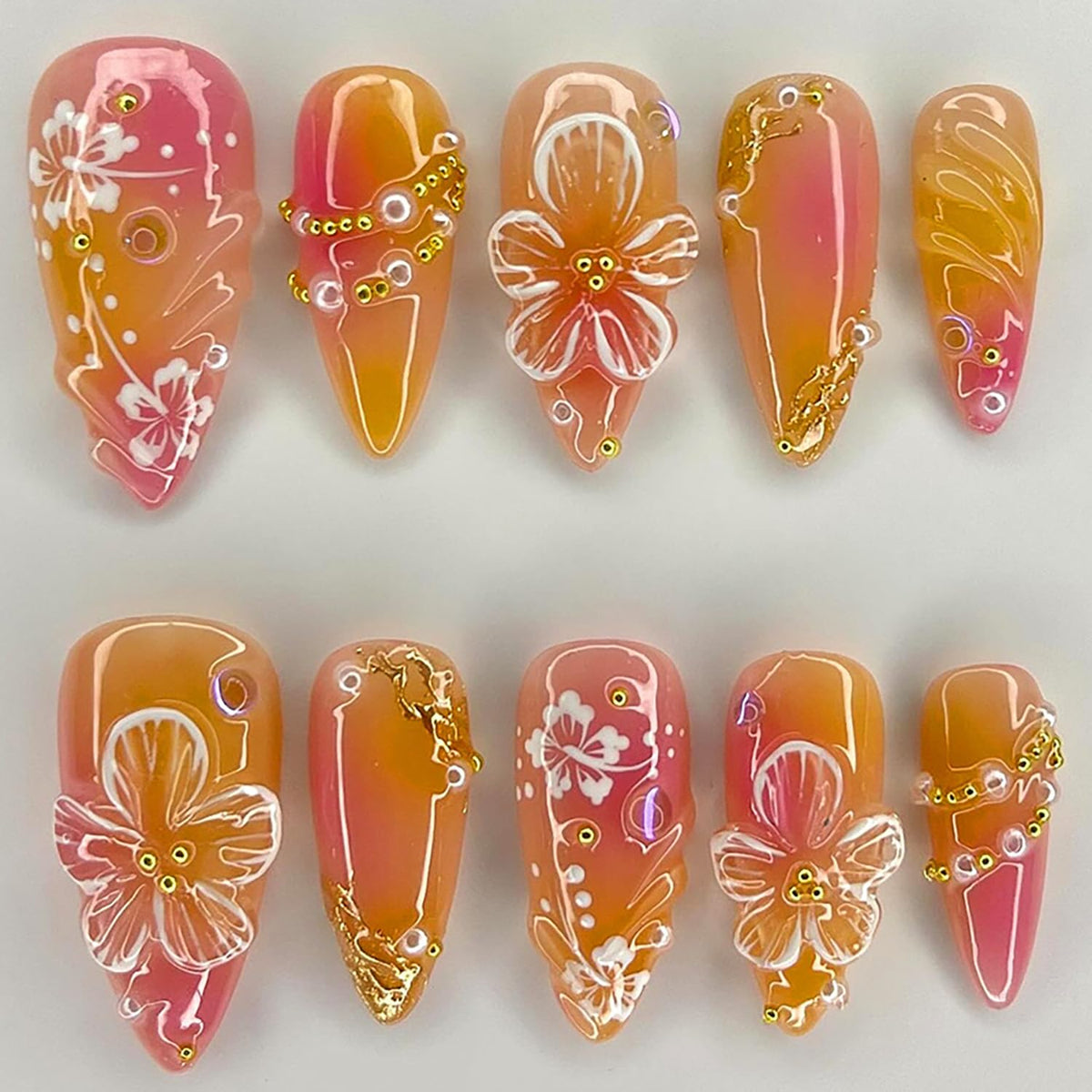 krtbkr front packaging showing orange floral press-on nails, ready-to-wear style