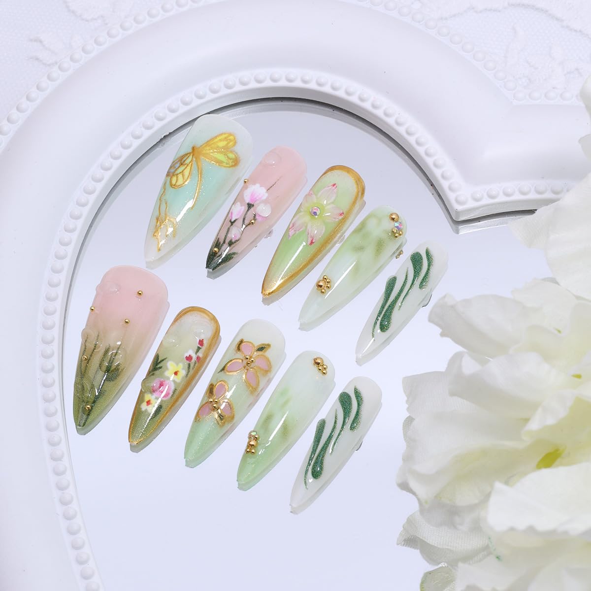 KRTBKR side profile of long stiletto nails showing sleek shape and salon-like finish