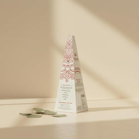 Kumari Kulture cone held in hand to show scale and single-session portion size